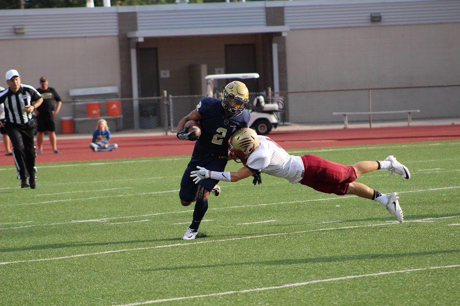 Collin Fewox dives to make a tackle in an attempt to slowdown the Klein Collins rushing attack.