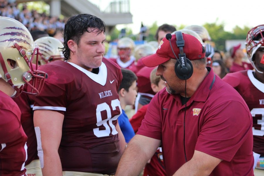 OL Ryan Kelly listening to a coach.