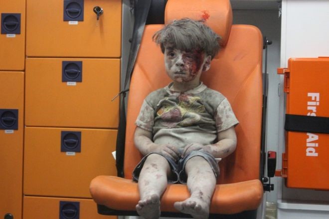 Snapshot+from+the+video+of+Omran+Daqnees+in+the+back+of+an+ambulance+following+his+rescue