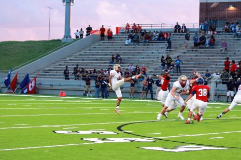 Luis Reyes kicks a field goal.