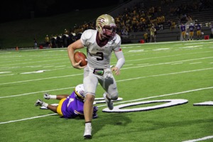 Quarterback Jacob Kainer dusts a Jersey Village defender. 