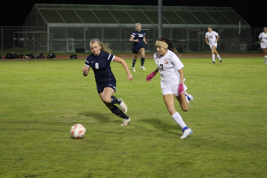 Brianna Vasquez dribbles away from a Cy Ranch defender.