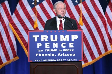 Jeff Sessions stands before an audience delivering a speech regarding Donald Trump's immigration policy.
