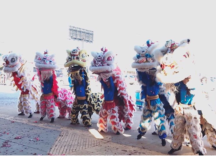 Anthu Le and her team dancing the lion dance.