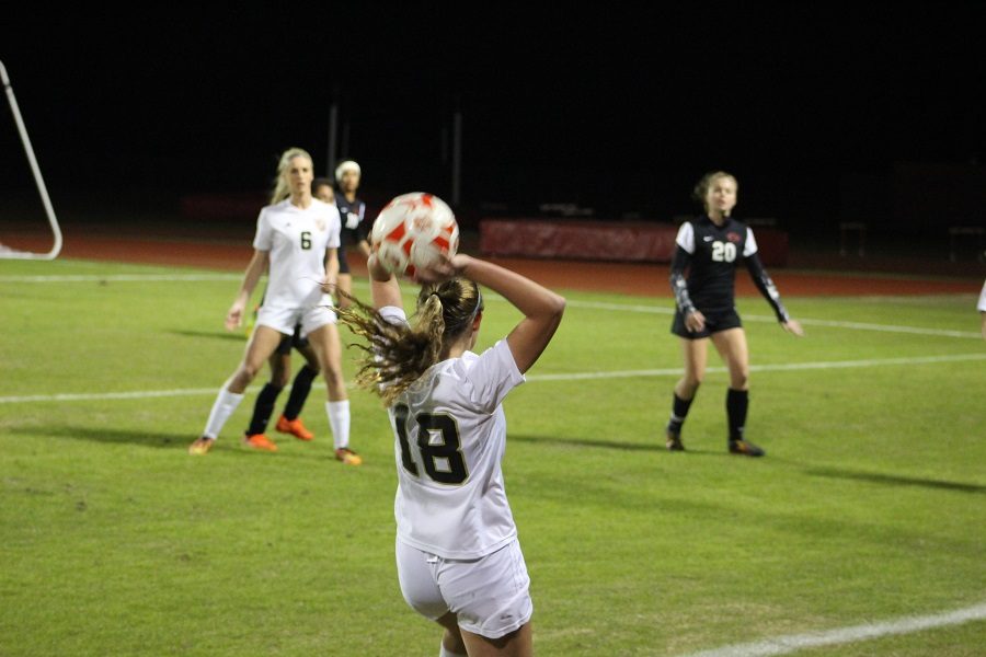 Colette Lacour throws in the ball.