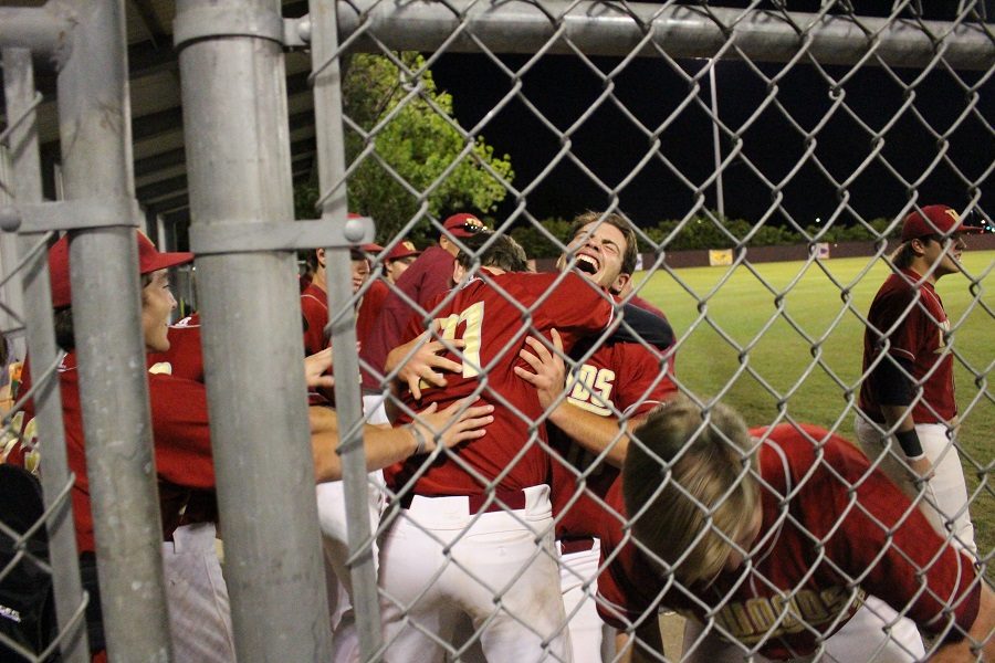 Gerardo Petito (facing camera) celebrates with teammates after the Wildcats tied the score.