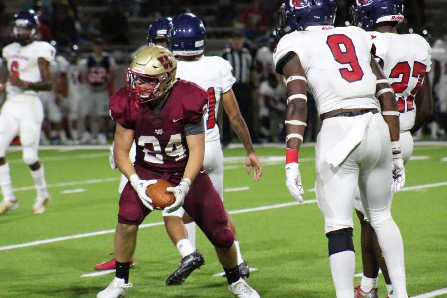 Running Back Bobby Dodson celebrates after running for a first down.