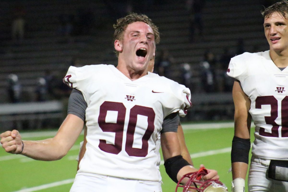 Defensive Lineman Jozef Taylor celebrates after winning the game against Cy Ridge.