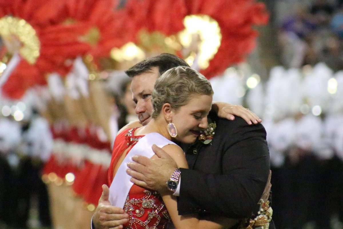 Senior+Maren+Mullally+hugs+her+father+after+being+announced+as+the+Homecoming+Queen.