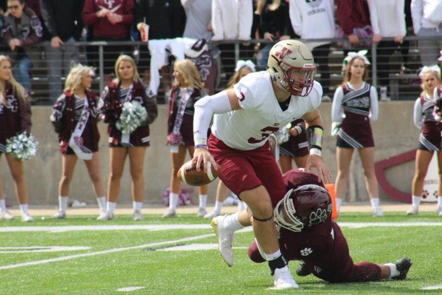 Quarterback Jacob Kainer is sacked by a Cy-Fair defender during the second quarter.