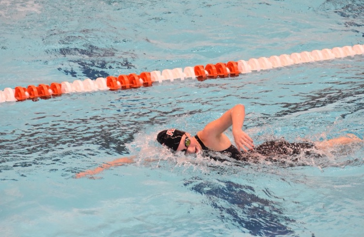 Sydney Stanford swimming at a meet.