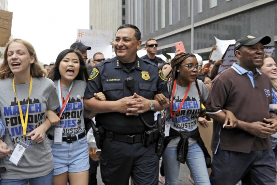 Kelly Choi (second to left) marches at the Saturday March For our Lives rally.