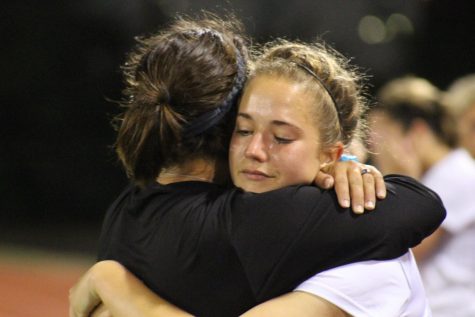 Senior Alyssa Correa hugs Assistant Coach Kellie Brewer after losing to Katy Tompkins 2-0 in overtime.