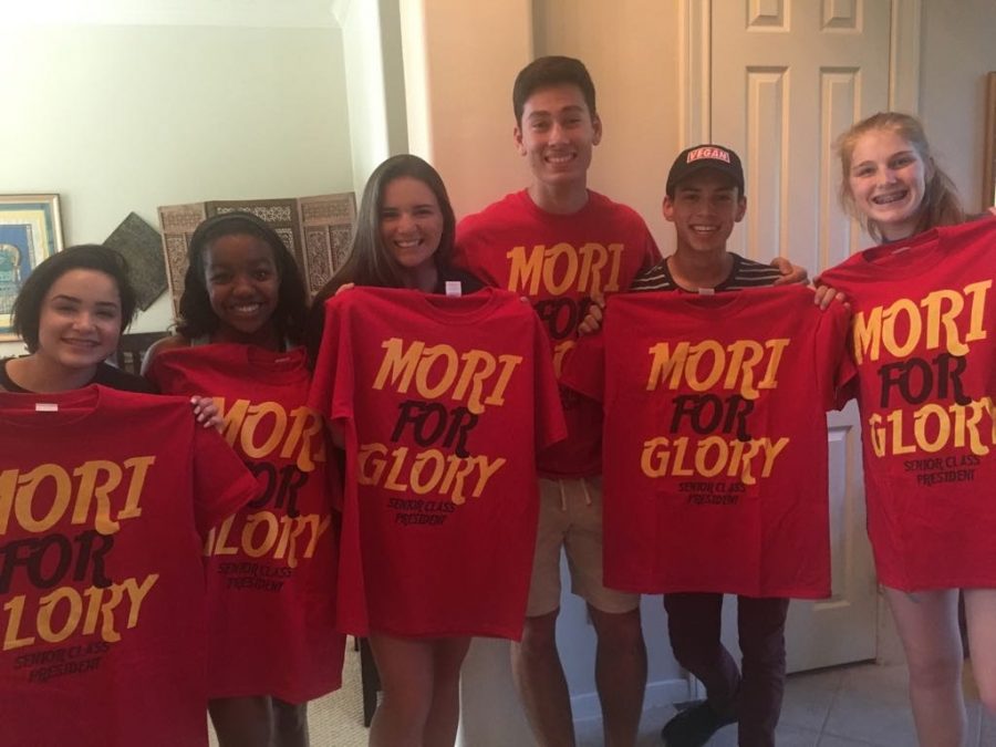 2018-2019 Senior Class President Matthew Mori [fourth to right] stands with his friends and campaign shirts labeled Mori for Glory before the 2018 election.