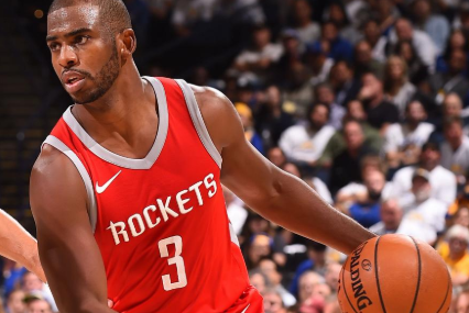 Chris Paul dribbles the ball for the Houston Rockets