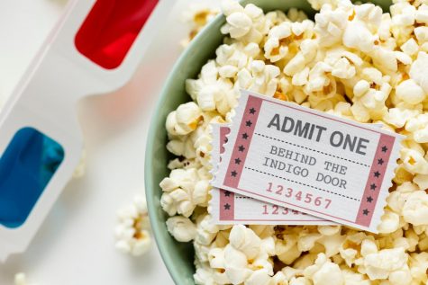Some popcorn, tickets, and a pair of 3D glasses
