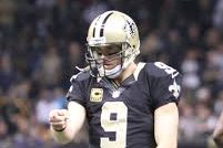 Drew Brees celebrating after a touchdown score  
