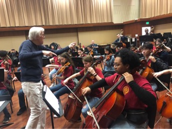 A photo of the orchestra rehearsing 