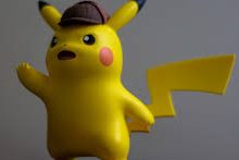An Amiibo figure of Detective Pikachu as he is portrayed in the game.