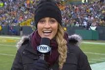 Erin Andrews, a well known female sports broadcaster, delivers game stats at a Packers game