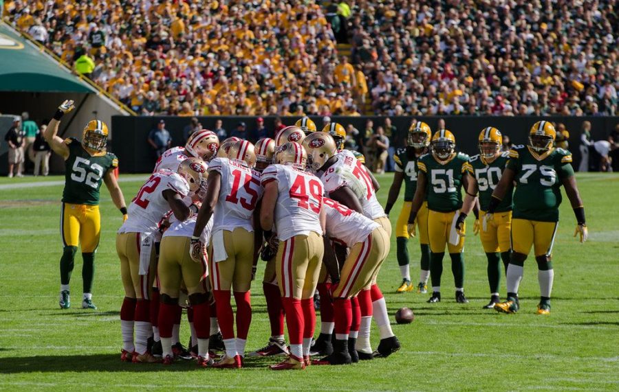 The San Francisco 49ers huddles up before they ran a play against the Green Bay Packers