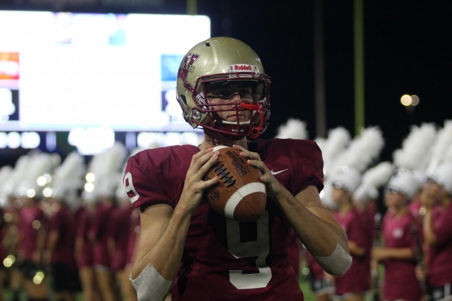 Senior Jackson Jones winds up for a throw at varsity football game against Tomball-Memorial on September 13. 