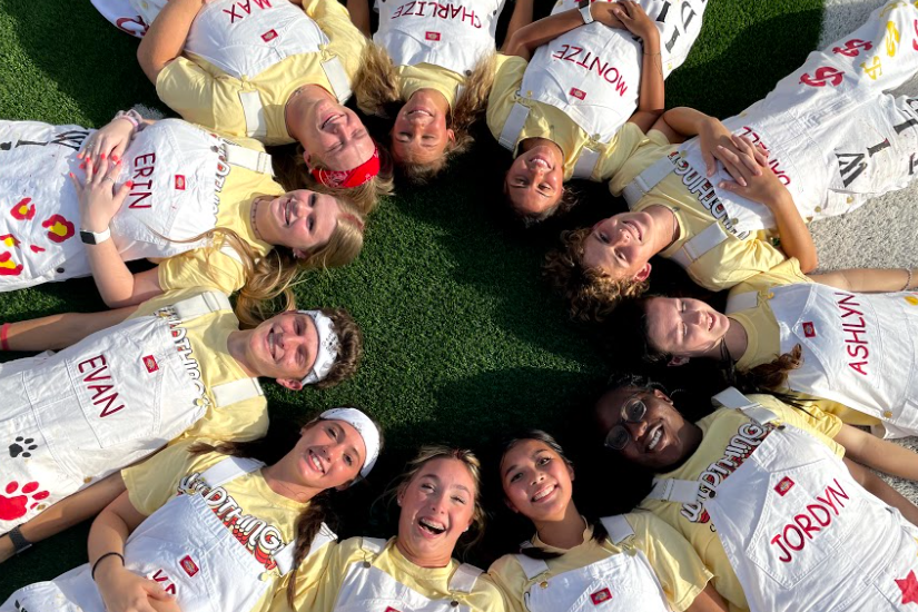 The Wildthings take a photo at the Cy Woods football game.