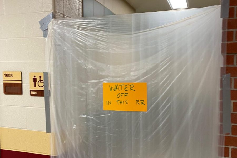 The boys bathroom with the water shut off to prevent students from going in. 