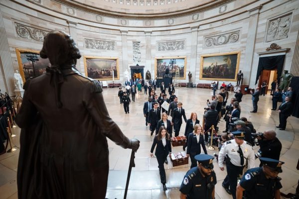 Senate pages carry ballots into the capitol building