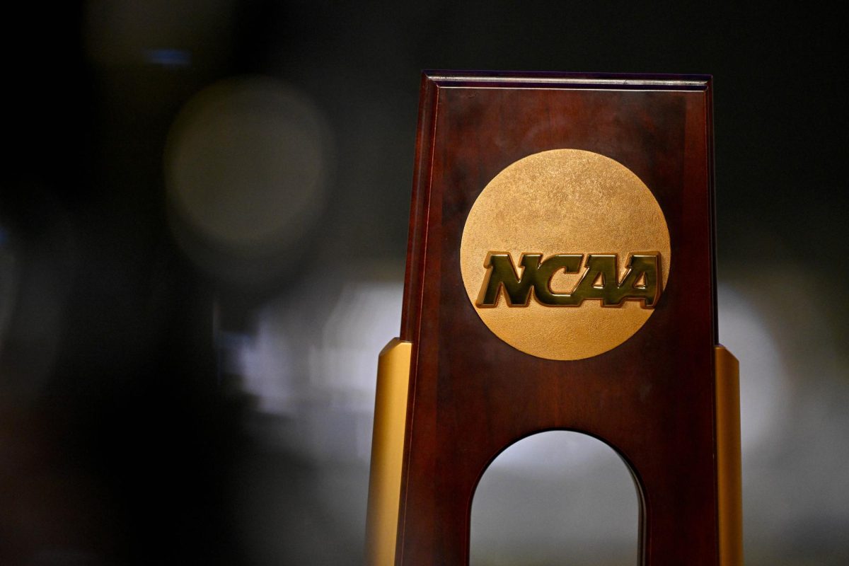 Apr 19, 2025; Fort Worth, TX, USA; A view of the NCAA logo and trophy before the 2025 Women's National Gymnastics Championship at Dickies Arena. Mandatory Credit: Jerome Miron-Imagn Images
