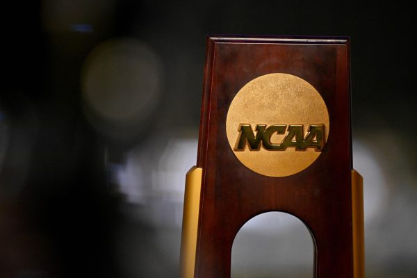 Apr 19, 2025; Fort Worth, TX, USA; A view of the NCAA logo and trophy before the 2025 Women's National Gymnastics Championship at Dickies Arena. Mandatory Credit: Jerome Miron-Imagn Images