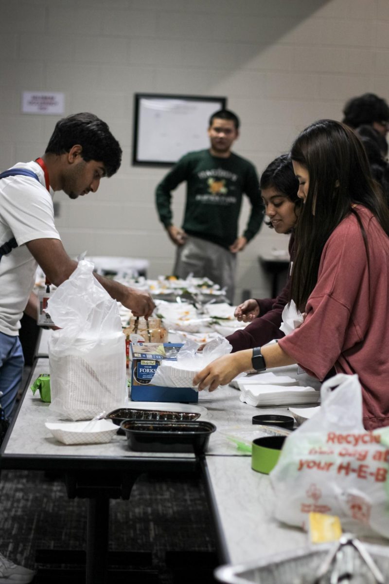 APACC officers set up Korean food before a meeting.