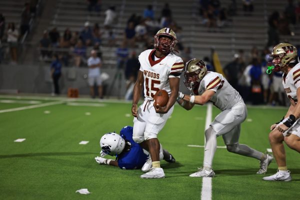 Following a forced turnover, senior linebacker Larry Boykin celebrates with the defense. The Wildcats beat Cy Creek 42-10. Starting this fall, Creek will be an one of the football, basketball and volleyball teams' in-district opponents.
